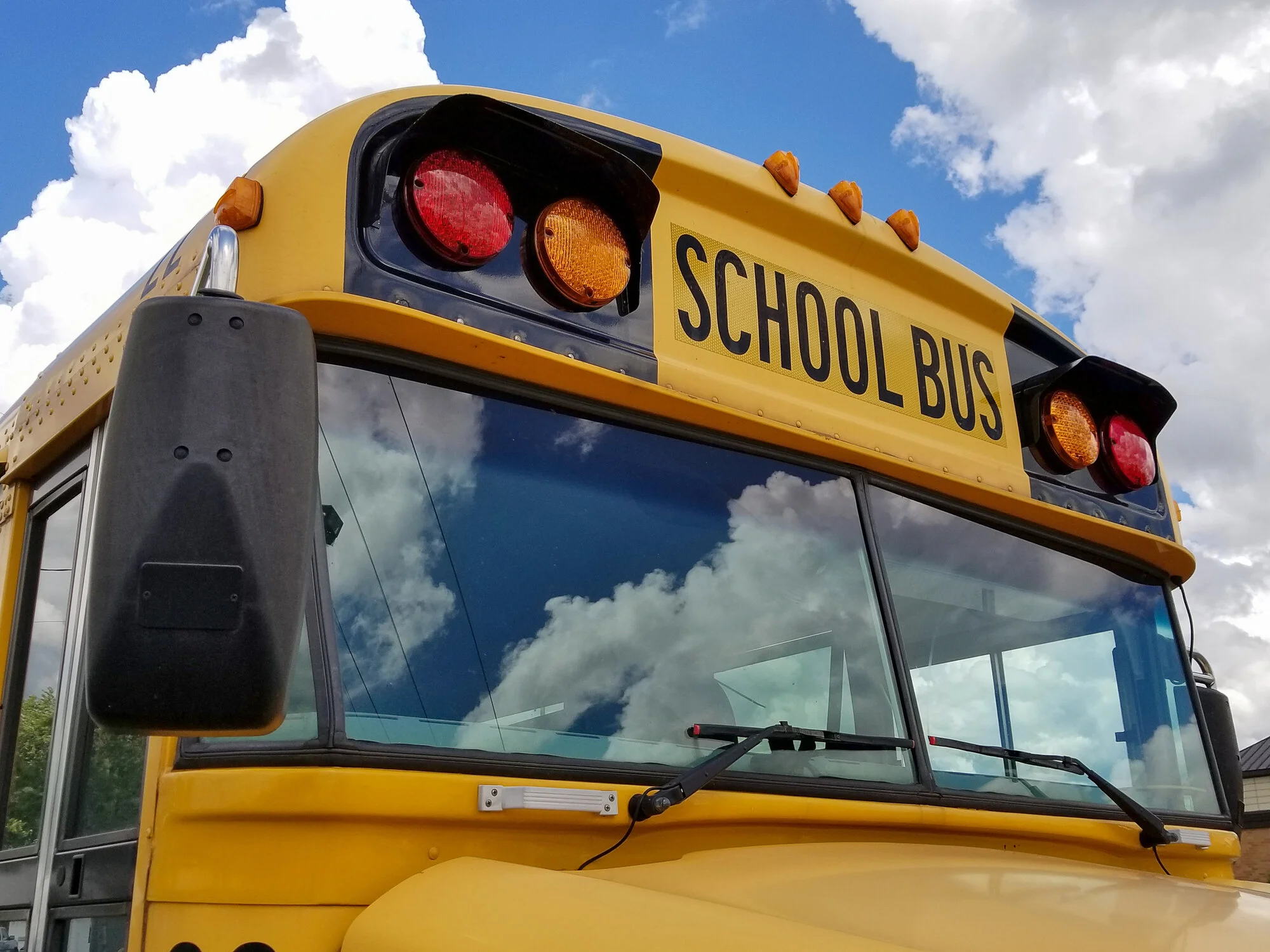 Torque Super-Duty wash cleaning a school bus front